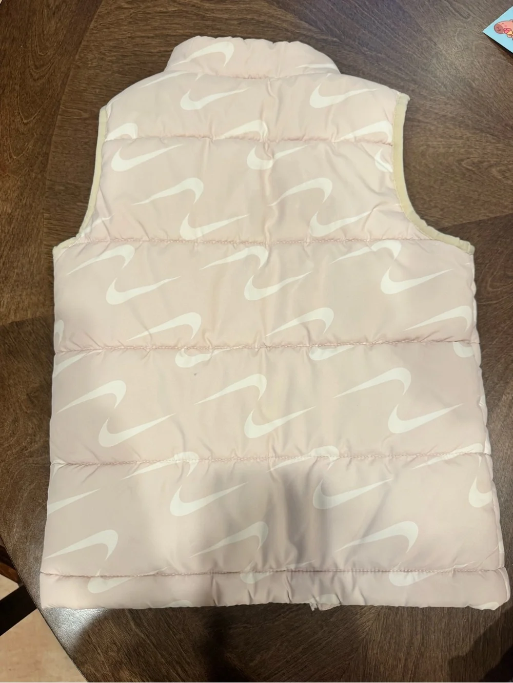 Nike Kids Light Pink Puffer Vest with White Swoosh Pattern